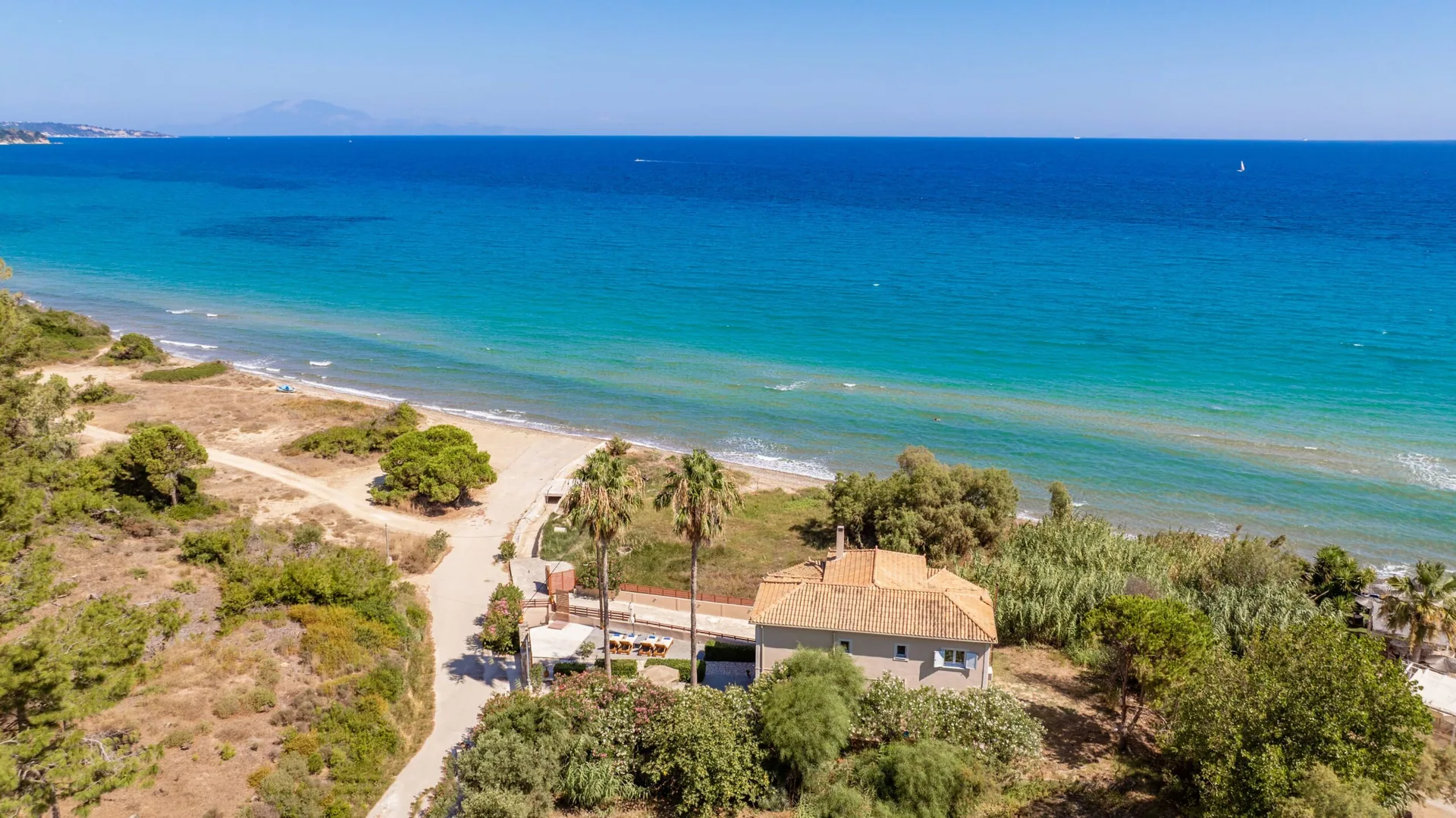 Aerial approach to the villa and sea